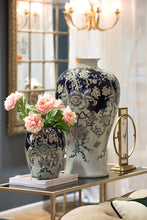 Load image into Gallery viewer, dorned in beautiful blues and golds, the Bryn Porcelain Urn is a true masterpiece. Crafted from sleek Porcelain with a high gloss glaze, its intricate details make it a work of art.
