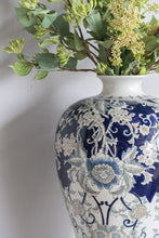 Load image into Gallery viewer, Intricate Blue and Gold Porcelain Urn: A stunning artwork with intricate details, crafted from durable porcelain in a glossy finish.
