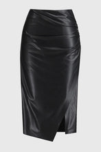 Load image into Gallery viewer, Leatherette pencil skirt with hidden elastic waistband, side shirring, and wrapped front, blending comfort with chic elegance.
