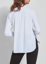 Load image into Gallery viewer, A woman in a white shirt &amp; black pants - the Connie Slim Button Down. Perfect for any occasion, its slim fit &amp; longer back hem creates a stylish silhouette. 
