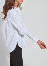 Load image into Gallery viewer, Image shows a woman in a tailored slim-fit button-down shirt, made of wrinkle-resistant Microfiber and four-way stretch blend fabric for everyday wear.
