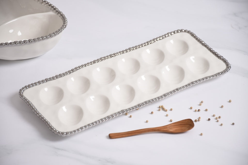 Deviled egg tray in Salerno, perfect for brunch or Easter. Display deviled eggs or sushi. Gleaming white porcelain with silver beads.