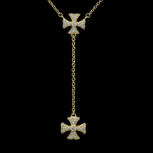 A gold cross necklace adorned with sparkling diamonds, elegantly showcasing its luxurious design and craftsmanship.