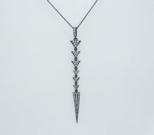 A sophisticated black necklace with a diamond arrow, embellished with pave triangles and a chic spear design.