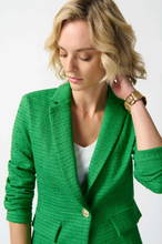 Load image into Gallery viewer, This bouclé blazer showcases a notched collar and boxy silhouette, combining long sleeves and a single button for a polished look.
