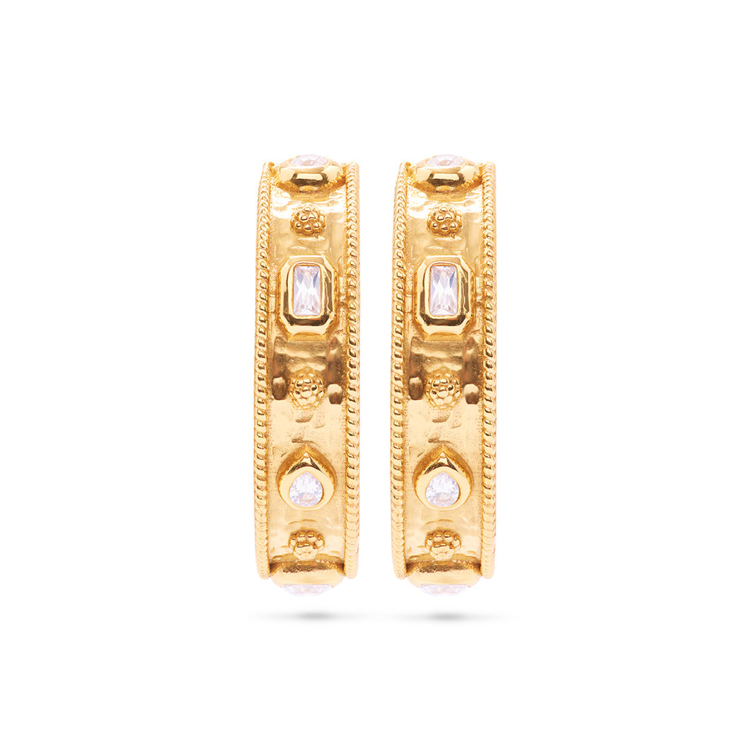 A pair of gold hoop earrings adorned with clear cubic zirconia, showcasing a hammered texture for added elegance.