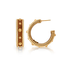 Load image into Gallery viewer, Gold hoop earrings adorned with brown leather, featuring a stylish design named Berry Medium Hoop Earrings - Teak.
