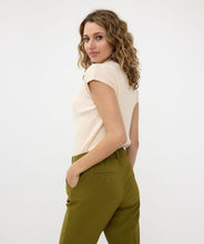 Load image into Gallery viewer, Basic top in sand with a low turtleneck, composed of a cozy fabric blend: 50% viscose, 28% polyester, and 22% nylon.
