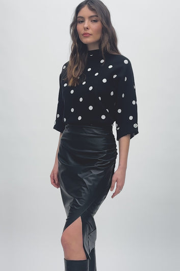 Luxurious leatherette pencil skirt, showcasing a hidden elastic waistband and stylish shirring for a sophisticated, flattering fit.