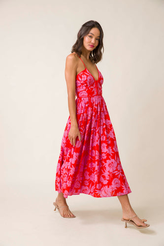 Make a statement this summer with the Line and Dot Jennie Midi Dress. Its eye-catching red floral design and comfortable fit are perfect for any daring fashionista.